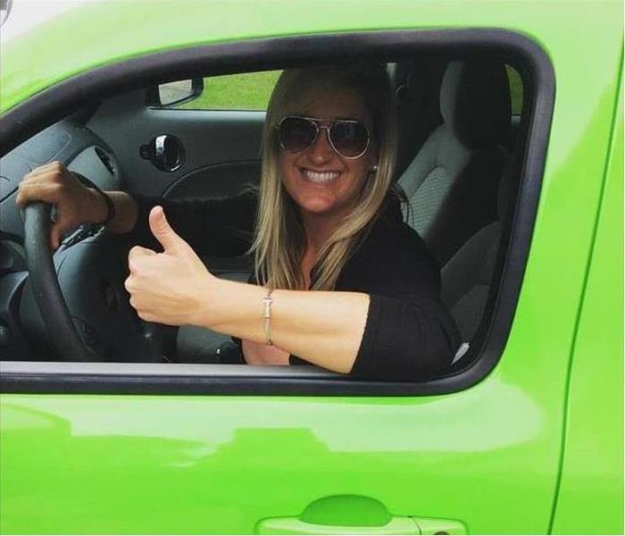 Ready for Whatever Happens! - Image of woman in green vehicle